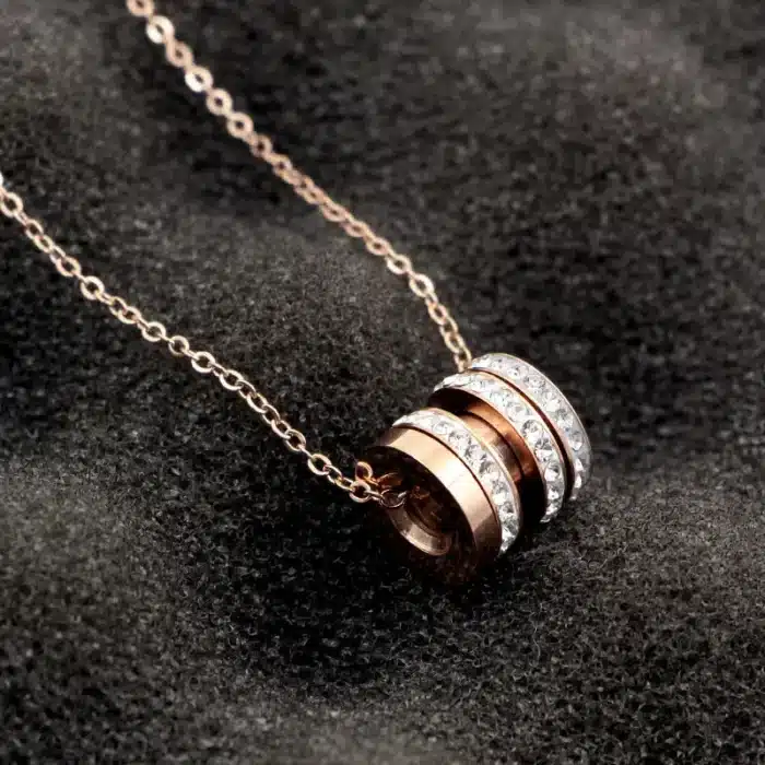 collier talisman cylindre or​ 9