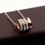 collier talisman cylindre or​ 7