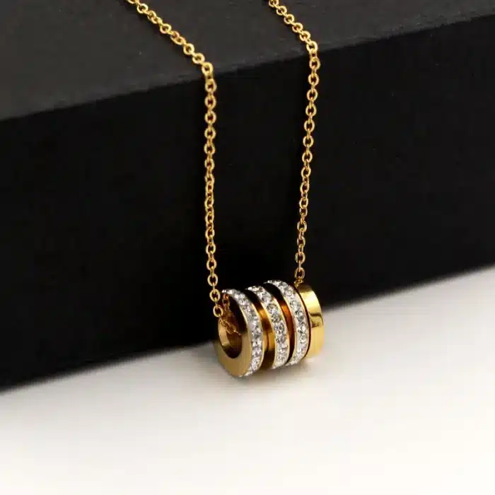 collier talisman cylindre or​ 1