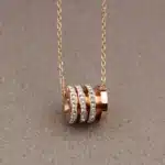 collier talisman cylindre or​ 3